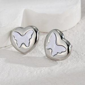 Polished heart shaped stainless steel stud earrings with butterfly shell inlay detail