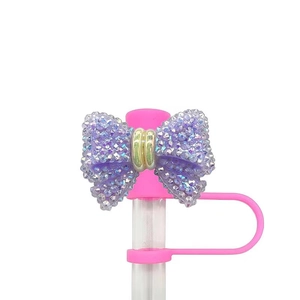 Pink rhinestone bow straw cover cap for 10mm Stanley cups in vibrant purple sparkle finish