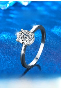 Macro shot of oval cut moissanite set in polished S925 sterling silver ring detail