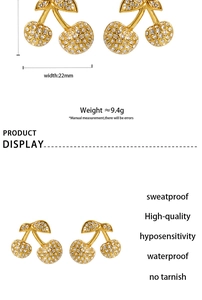 Detail view of golden cherry stud earrings with zircon inlay showing 22mm width and 9.4g weight