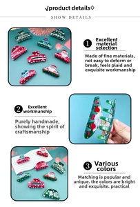 Detail view of colorful PVC Christmas hair claws with festive Santa and tree patterns