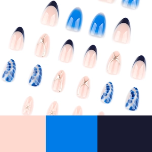 Blue almond press-on nails with french tips and gradient starry designs on white base