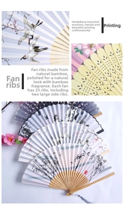 Detail of traditional bamboo fan ribs and printed silk fabric with crane motifs