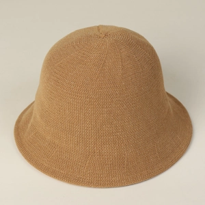 Detail of the fine knit texture and soft brim on this camel-colored bucket sun hat