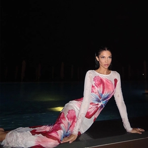 Close-up of pink and blue floral mesh fabric on a fitted long-sleeved dress