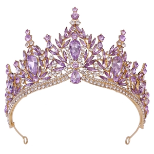 Detailed macro view of golden bridal crown with purple crystal leaf patterns