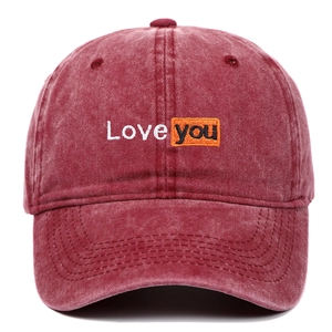 Close-up of Love you embroidery on washed burgundy vintage style baseball cap
