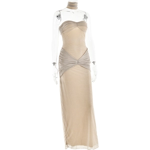 Detail of champagne evening gown with shimmering fabric and elegant pleated chest design