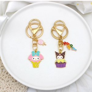 Detailed view of My Melody and Kuromi enamel keychains with lobster clasps on a plate