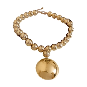 Statement chunky gold bead necklace with oversized mirror finish metal pendant for women