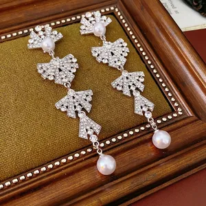 French vintage bow pearl tassel drop earrings with sparkling rhinestones in silver finish