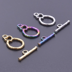 Detailed close-up of heart-shaped OT toggles in gold, silver, and rainbow finishes