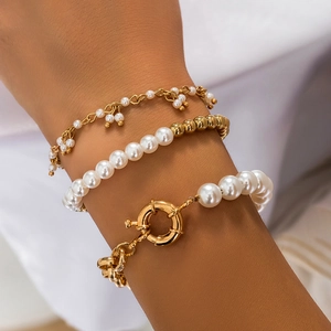 Three-piece pearl and gold chain bracelet set with rhinestone heart and ring clasp