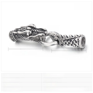 Macro detail of stainless steel dragon clasp for leather bracelet with punk engraving