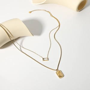Double-layered gold stainless steel necklace with sun moon plate and zircon pendant