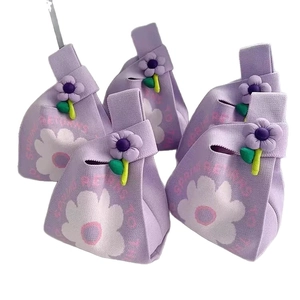 Purple floral knit gift bags with 3D flower decoration and Spring Returns print text