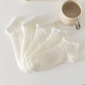 Five pairs of cream white ballet style cotton socks with lace hollow patterns