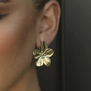 Golden five-petal flower stud earrings with brushed metallic texture and luxury finish
