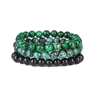Detail of bohemian triple-layered stretch bracelet set with green agate and obsidian beads