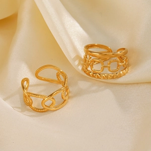 Adjustable gold plated stainless steel chain rings on elegant cream silk background