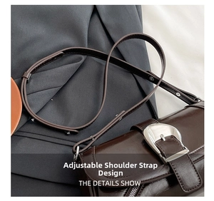 Detailed view of the dark brown leather bag showing the adjustable silver metal buckle
