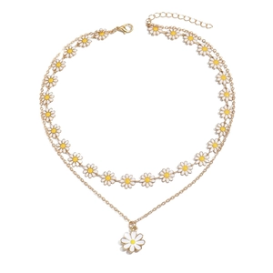 Double-layered gold necklace featuring daisy pendants with white and yellow floral details