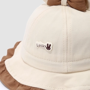 Toddler girl sun hat in beige with bow detail and Lucky bunny patch decoration