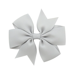 Macro shot of light gray grosgrain ribbon bow hair clip with detailed ribbed texture