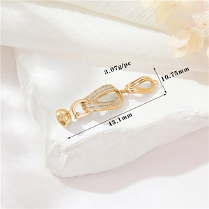Detailed view of golden magnetic pearl necklace clasp with measurements 43.1mm x 10.75mm