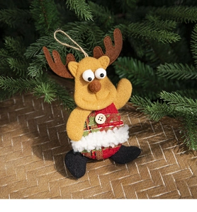 Close-up of yellow felt reindeer ornament with red plaid vest on Christmas tree branch