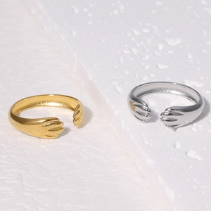Detail of adjustable stainless steel cat paw rings in gold and silver finish