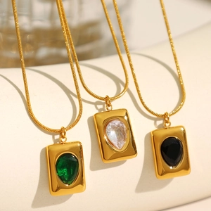 Textured square necklace set with emerald, clear, and black teardrop stones