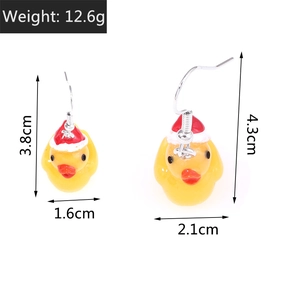 Detailed view of yellow duck earrings with size and weight specs on white background