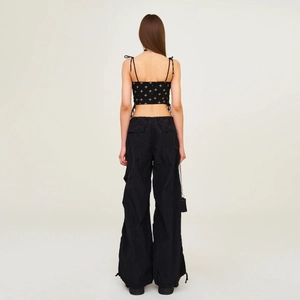 Women's black cotton tank top with white floral print and matching cargo pants