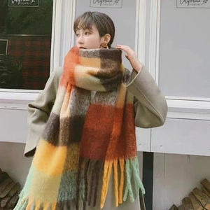 Rainbow striped winter scarf with thick knit fabric and long tassels on the ends