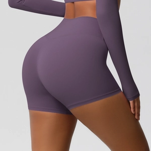 Detail of purple high-waisted yoga shorts showing fabric texture and butt-lifting seam