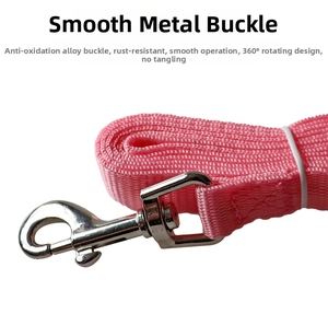 Detail of pink woven pet leash with a 360-degree rotating anti-rust alloy metal clip