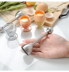 Detail of stainless steel egg topper set with silver, gold, and rose gold wire egg cups