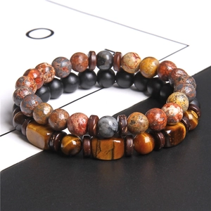 Macro shot of double-layer beaded bracelet featuring square tiger eye and round stone beads