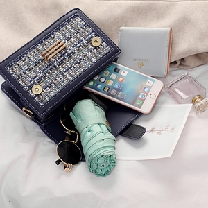 Blue faux leather crossbody bag with tweed flap and ample space for daily essentials