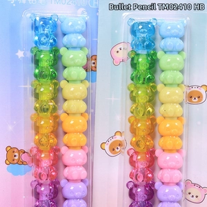 Detail of stacked bear-shaped non-sharpening pencils with colorful plastic segments