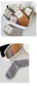 Detail of ribbed cuffs on combed cotton socks in Morandi tones and soft textures