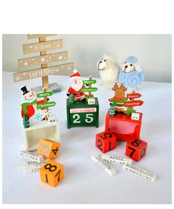 Detailed view of wooden Christmas countdown calendar blocks with Santa and Snowman figures