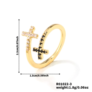 Detail view of adjustable cross ring with black and white zircon stone settings