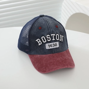 Detail view of children's Boston 1630 embroidery on mesh back baseball cap in retro style