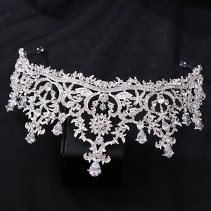 Detail of silver bridal crown featuring teardrop zircon crystals and floral patterns
