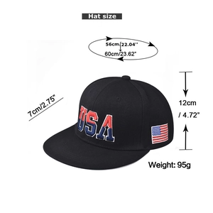 Detailed view of USA embroidery and American flag patch on a black cotton baseball cap