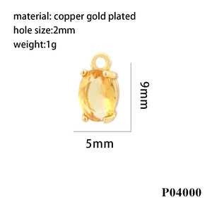 Detail view of 18K gold plated oval pendant with yellow zircon showing 9x5mm dimensions