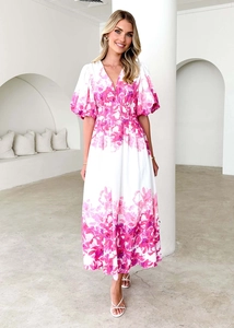 Detailed close-up of V-neck floral midi dress with puff sleeves on white background
