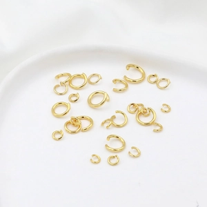 Detailed macro shot of 14K gold-filled jump rings for DIY jewelry connection